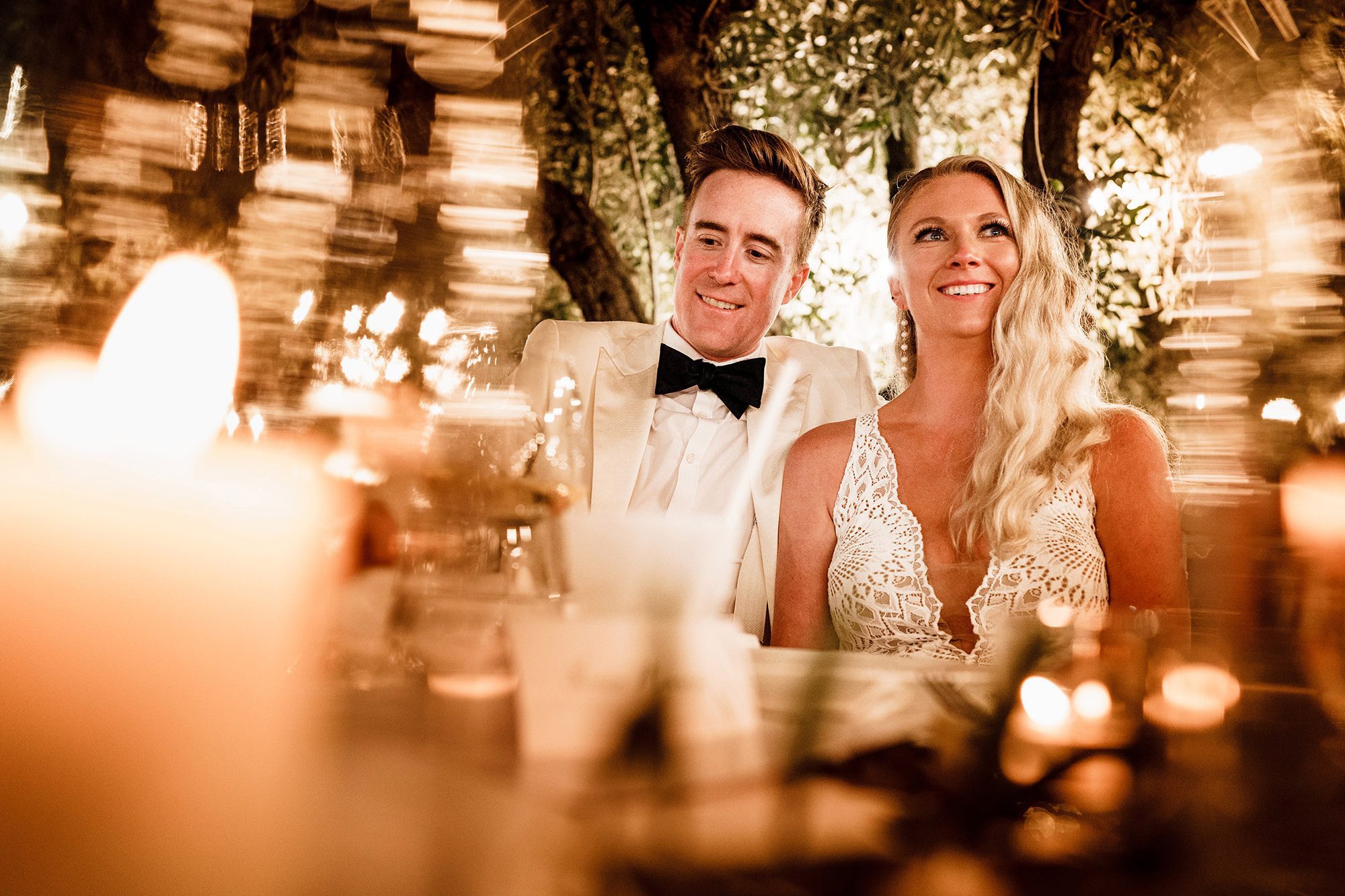 Couple photographed candidly at a wedding in Italy