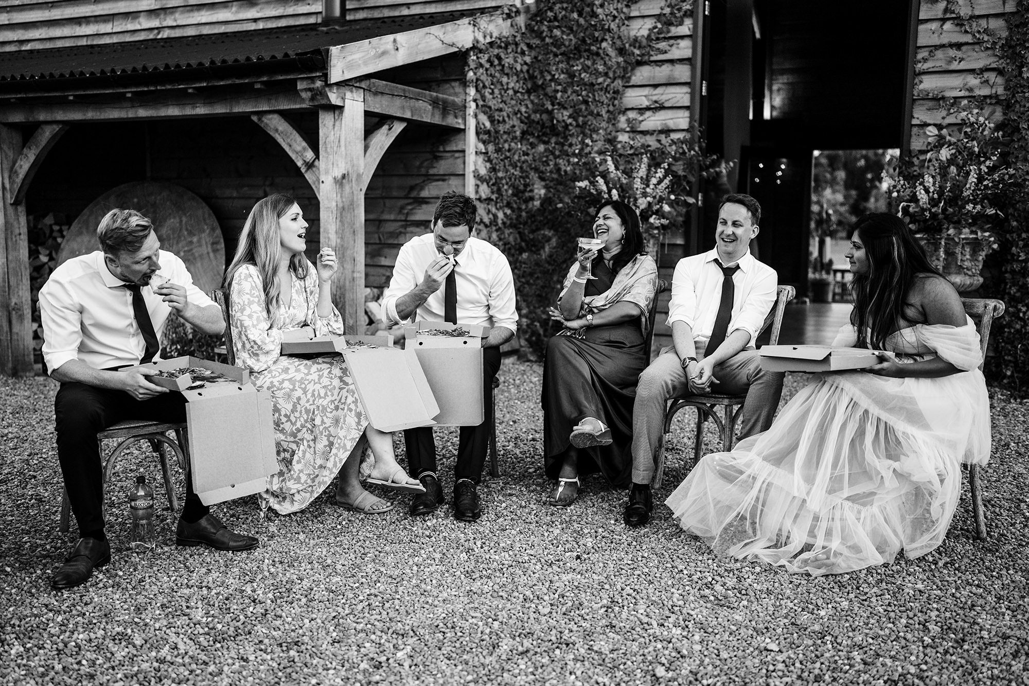 Wedding guests enjoying food during a candid wedding moment