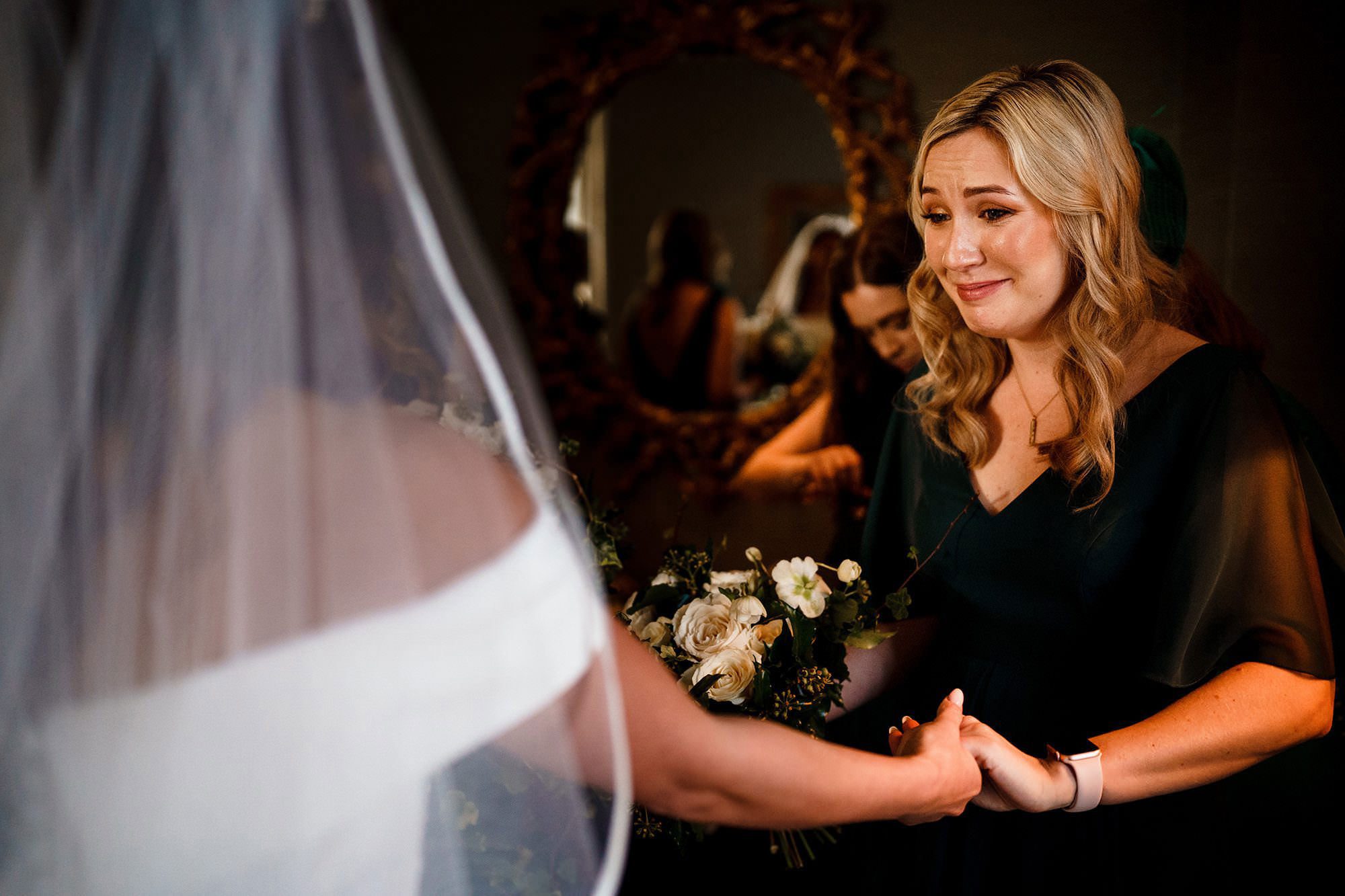 Bridesmaid photographed candidly during the wedding day