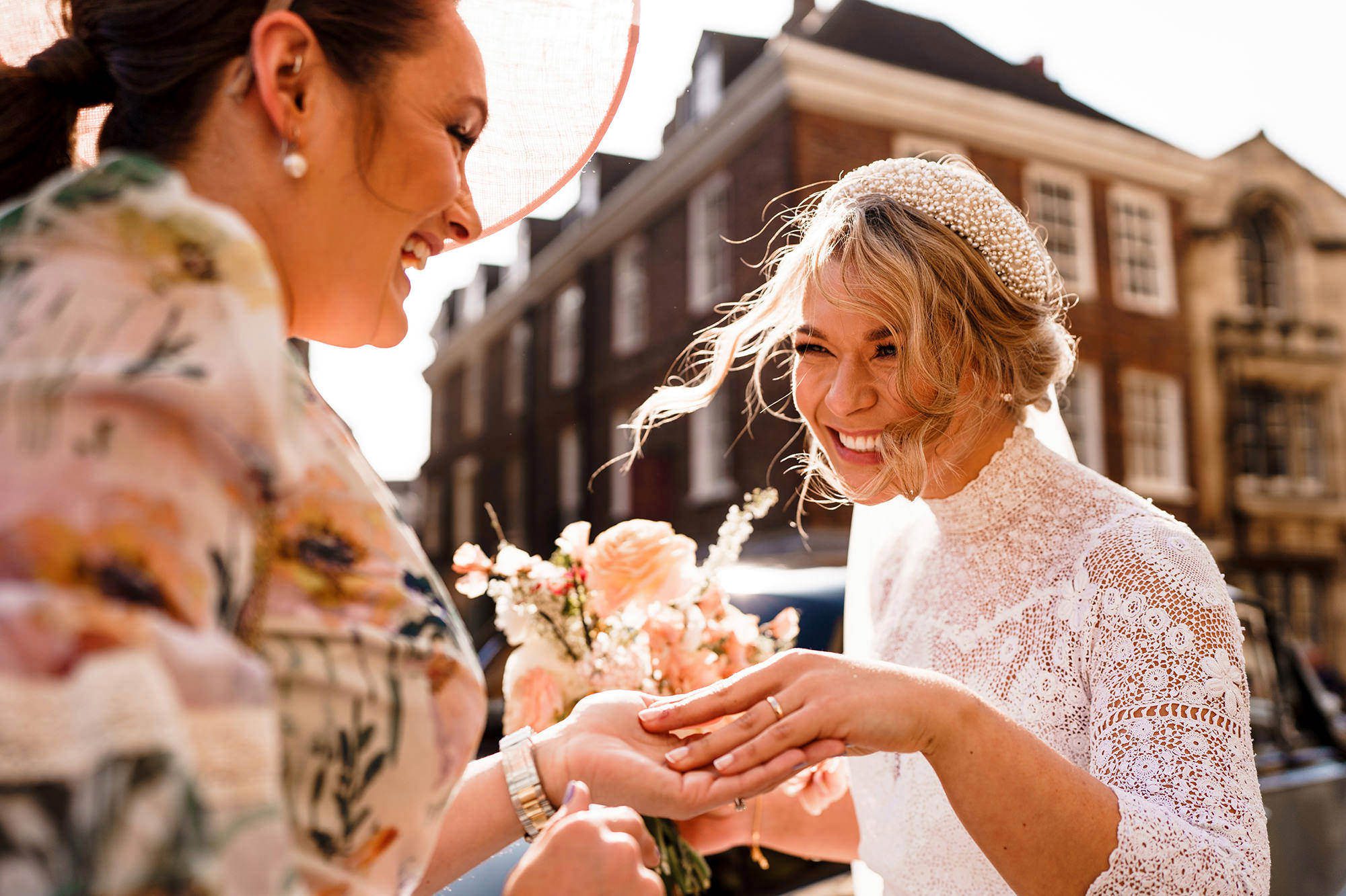 Bride showing her wedding ring after getting married in the Cotswolds