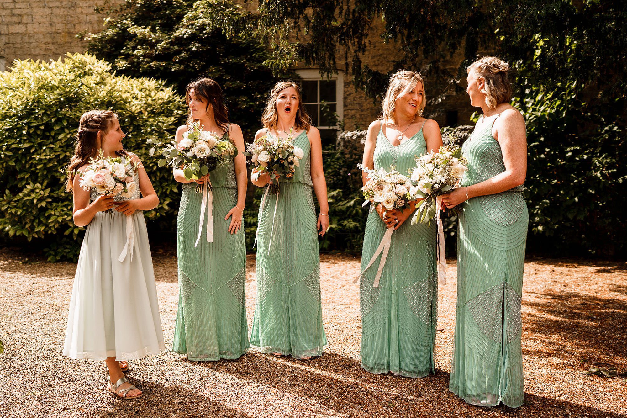 Bridesmaids waiting for the bride in the Cotswolds countryside