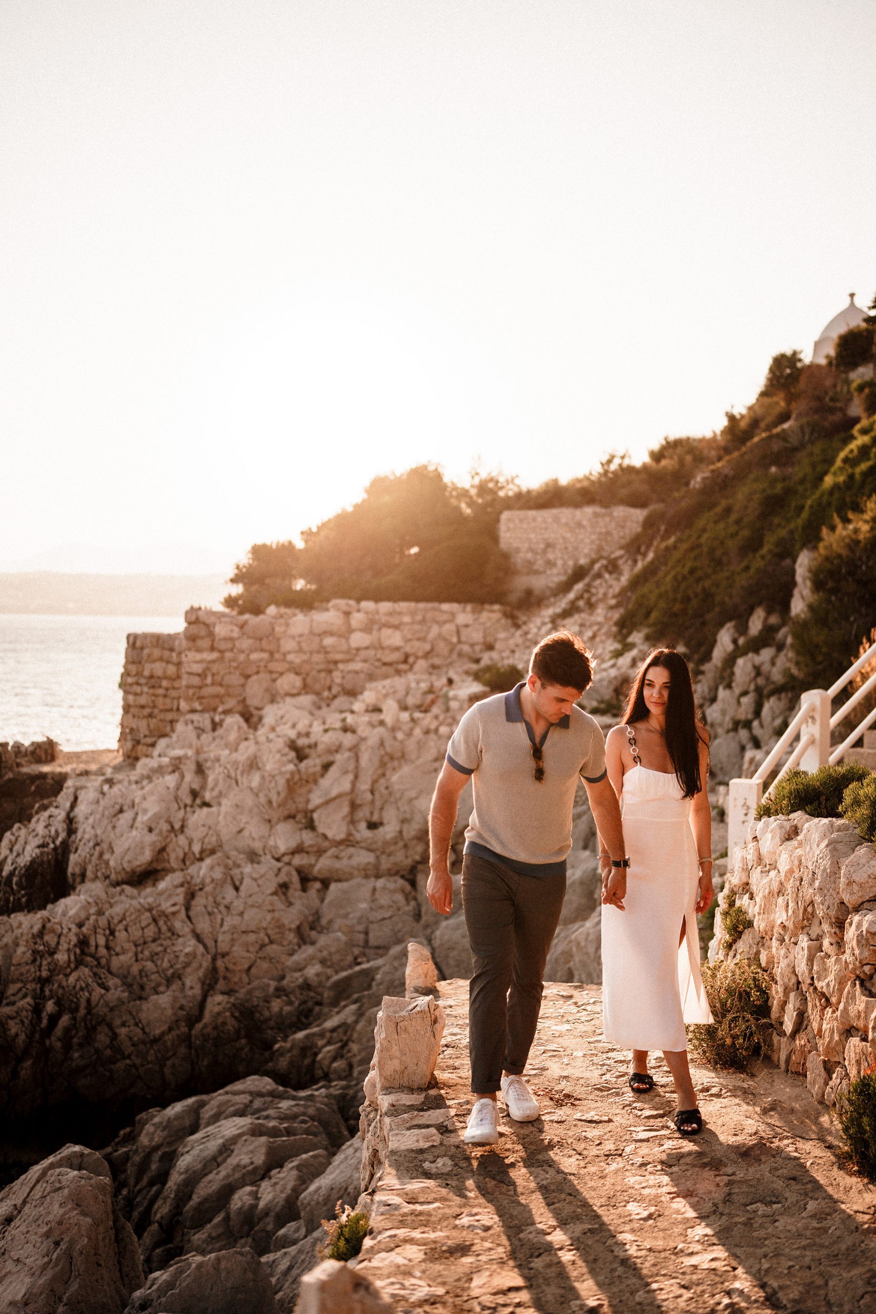 Couple holding hands during relaxed pre wedding shoot in France