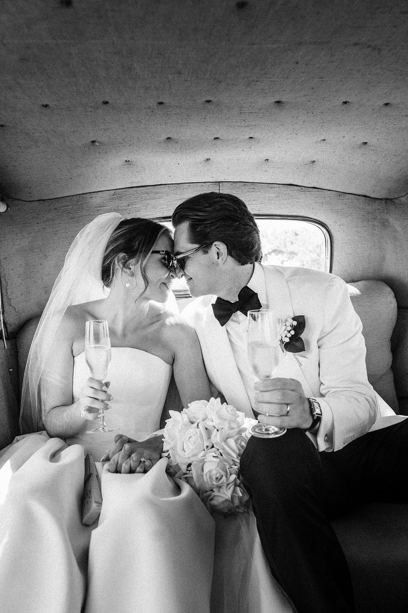 couple laughing together during wedding portraits